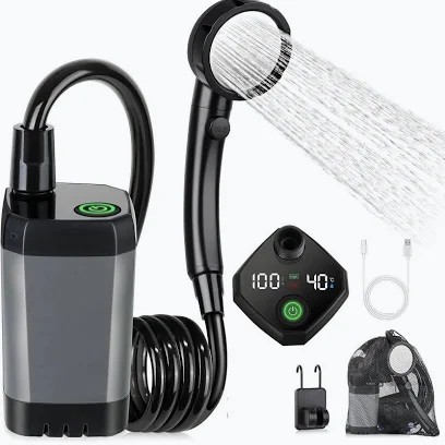 Graphite portable pump shower kit laid out with handheld head, coiled hose, readout panel, cable, hook and mesh bag